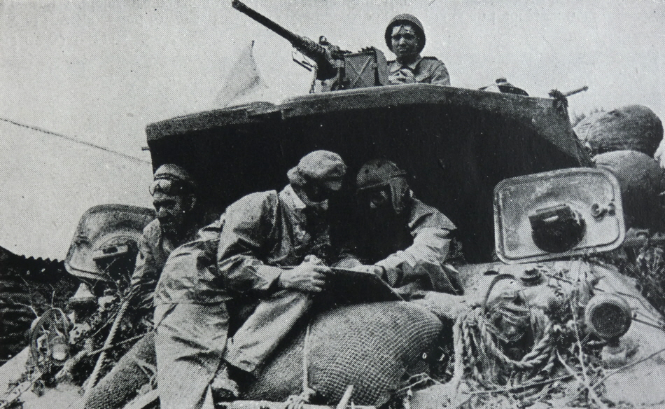 Crew of M10 Tank Destroyer consulting map 