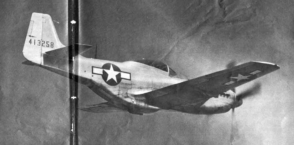 Late production North American P-51D from below-right