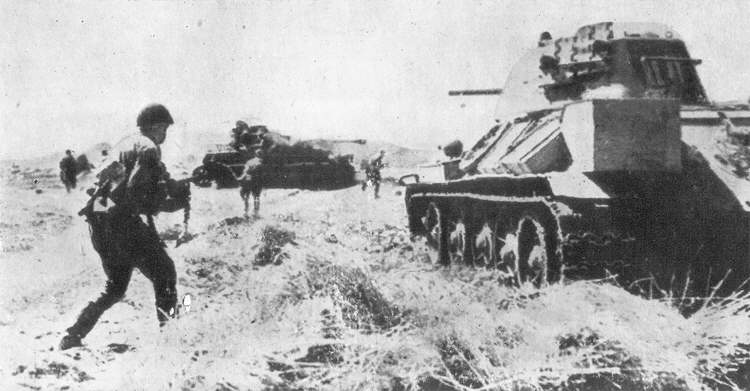 A Soviet T-34 Medium Tank supporting an infantry advance