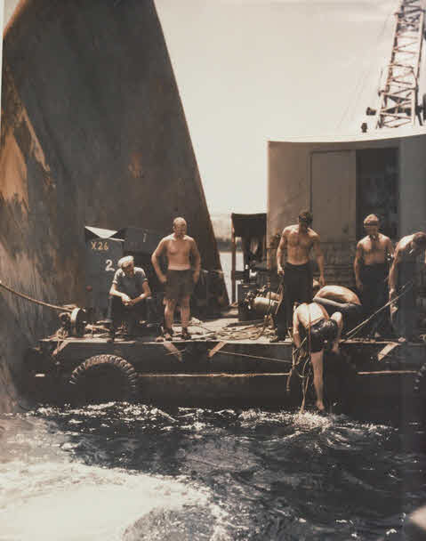 Divers work on bow of USS Pittsburg (CA-72), June 1945 