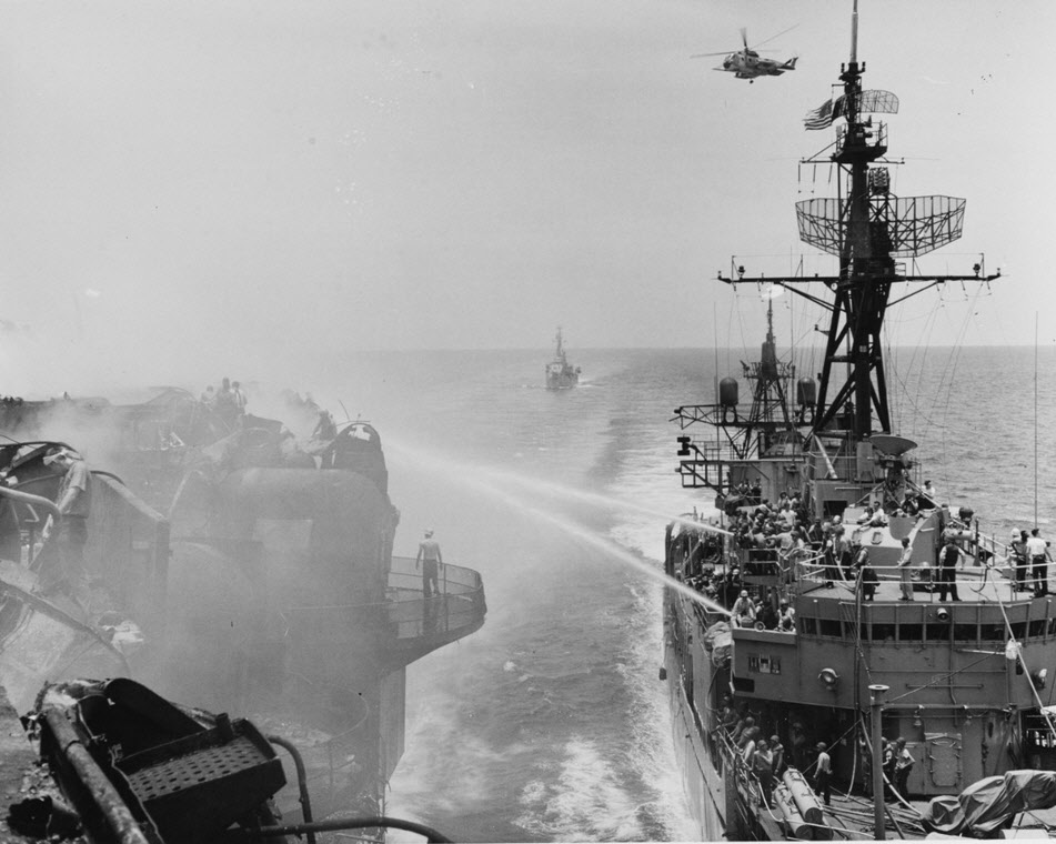 USS Rupertus (DD-851) fighting fires on Forrestal (CVA-59), Vietnam, 1967 