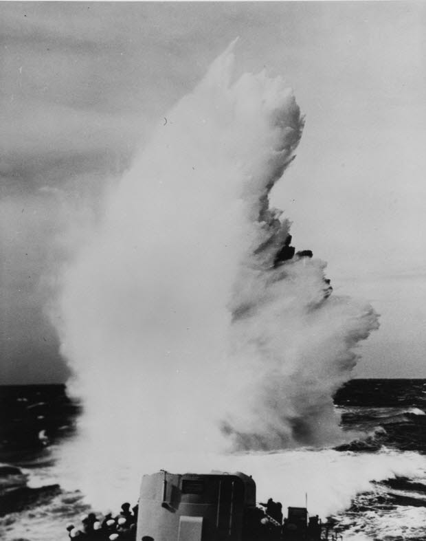 Depth charge explodes behind USS Stanly (DD-478) during 1942 trials 