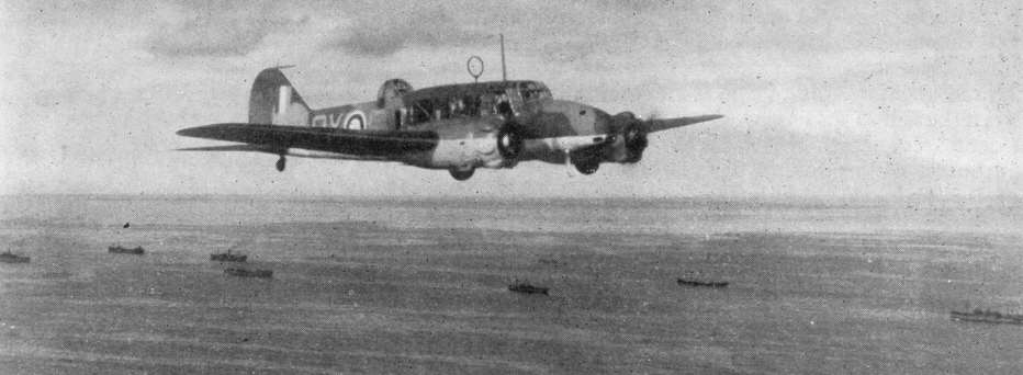 Avro Anson flying over a convoy