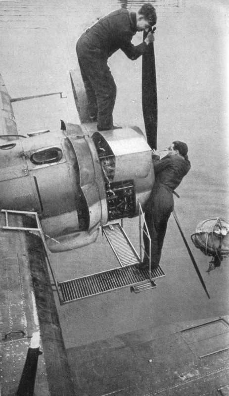 Engine fitters at work on a Catalina