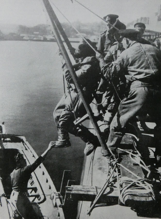 Royal Navy diver being lowered at Cherbourg