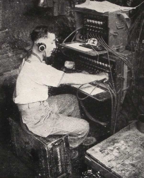 French Naval Gunner operating telephone switchboard, Italy 1944 