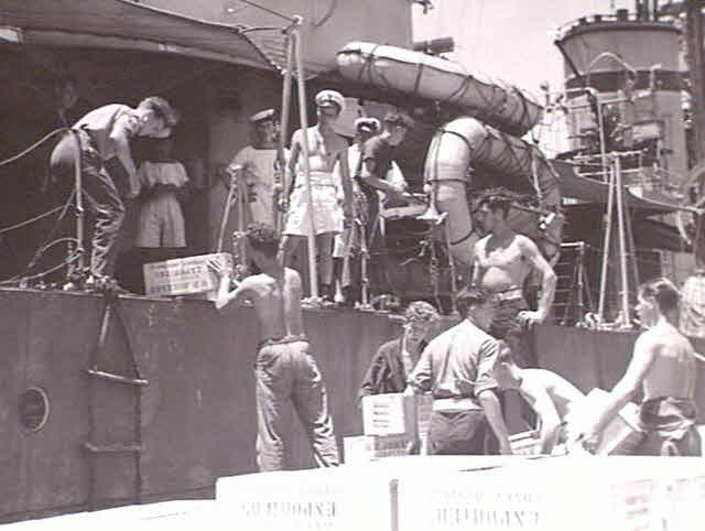 Loading food onto HMS Wizard, 1945 