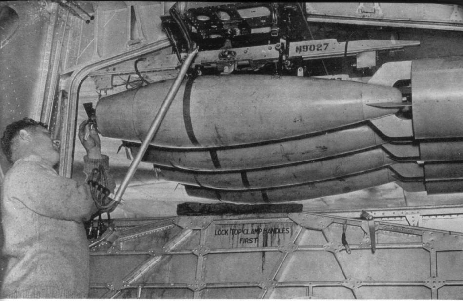 Heavy bombs being placed in the bomb bay of a Short Sunderland 