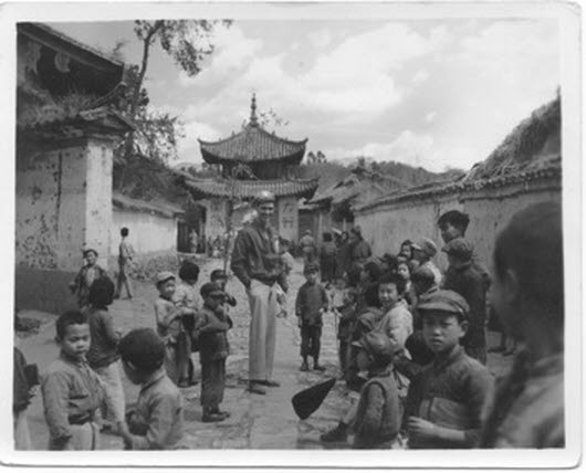 Captain Harold C. James, USAAF, at the temple gates, Kunming (1 of 2) 