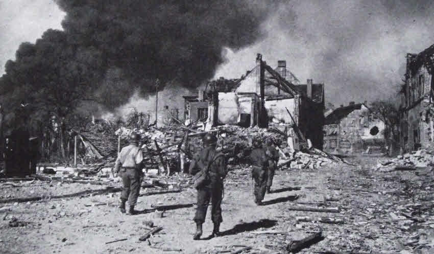 US Troops approach ruins, Gudingen, 1945 
