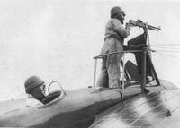 WWI gunner stands to fire over the propellor