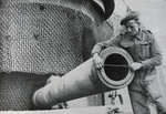 Allied soldier measures 380mm gun at Todt Battery 