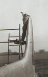 Robert S. Tucker Sr. working on the tail of a B-17 