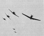 Formation of Curtiss P-40 coming towards camera 