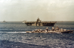 USS Bullard (DD-660) passing Essex class carrier before invasion of Okinawa 
