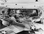Hanger full of P-40Fs on USS Chenango (CVE-28)