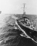 USS Cowell (DD-547) returning pilot to carrier during battle of Leyte Gulf 