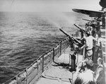 USS Enterprise (CV-6) firing AA Guns, 1942 