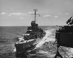 USS Helm (DD-388) alongside USS Makin Island (CVE-93) off Iwo Jima