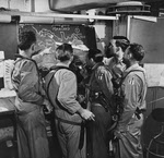 Pilots study map of Hong Kong, USS Hornet (CV-12), January 1945 