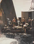 Divers work on bow of USS Pittsburg (CA-72), June 1945 