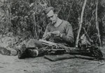 British Corporal cleaning Bren Gun, Burma 