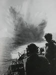 HMS Holmes drops depth charge off Normandy 