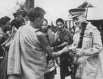 Lord Wavell receiving a gift from Naga hill men, Kohima 