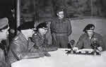 Field Marshal Montgomery reads the surrender document at Luneburg