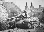 Tiger II in ruined village 