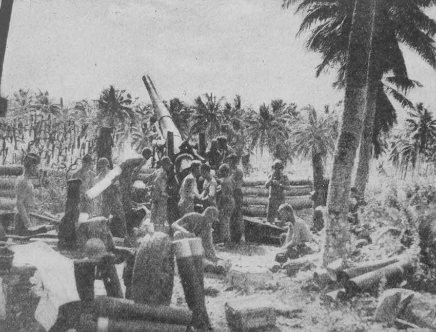 Loading a 155mm Gun M1 on Rendova 