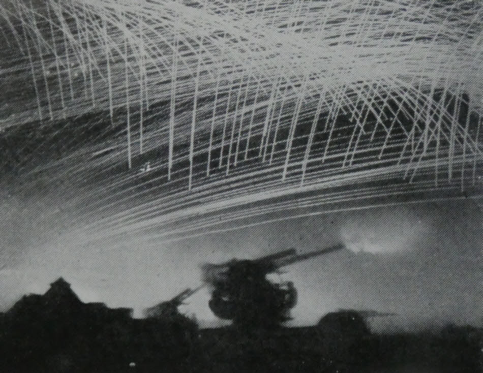 3.7in AA guns fire on V-1 Flying Bombs 