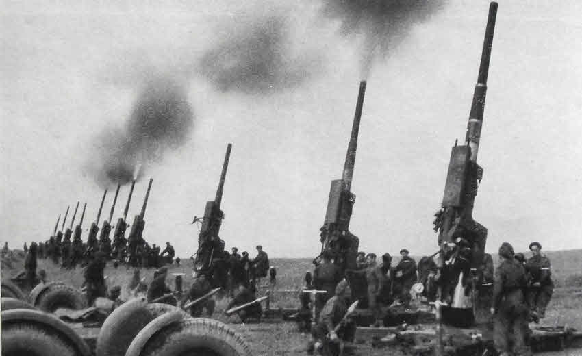 3.7in anti-aircraft guns firing victory salute 