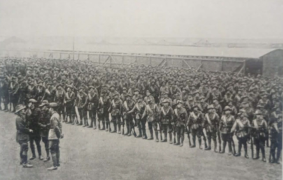 Men of Australian Imperial Forces prepare for George V 