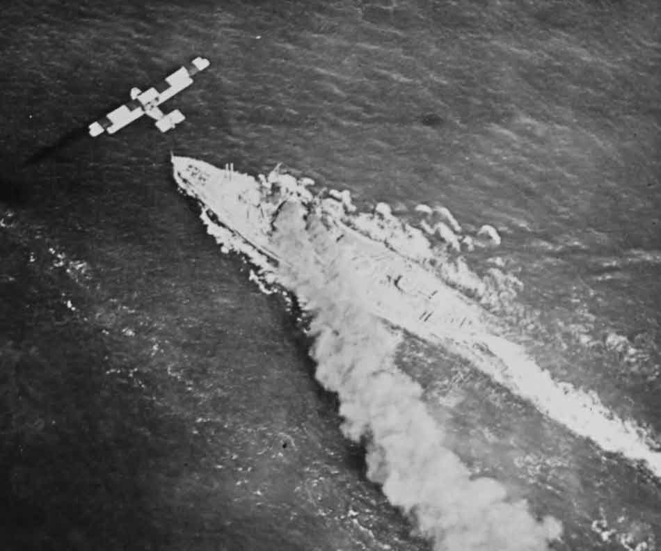 F-5L Flying Boat over USS Arkansas (BB-33)