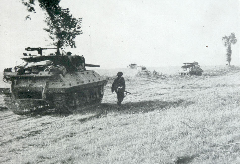 British M10s heading towards Troarn 