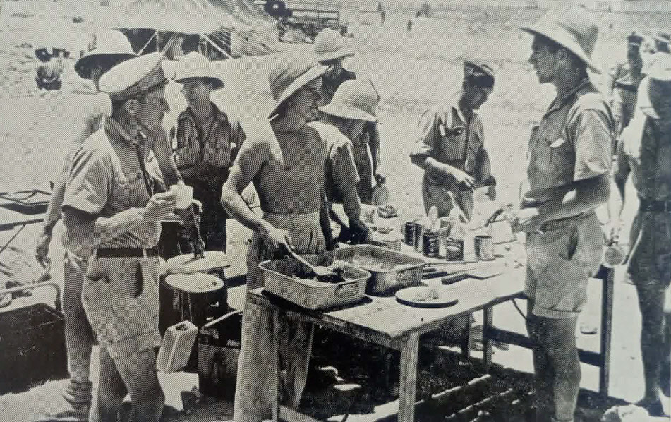 RAF and SAAF sharing lunch, Western Desert, c.1941 
