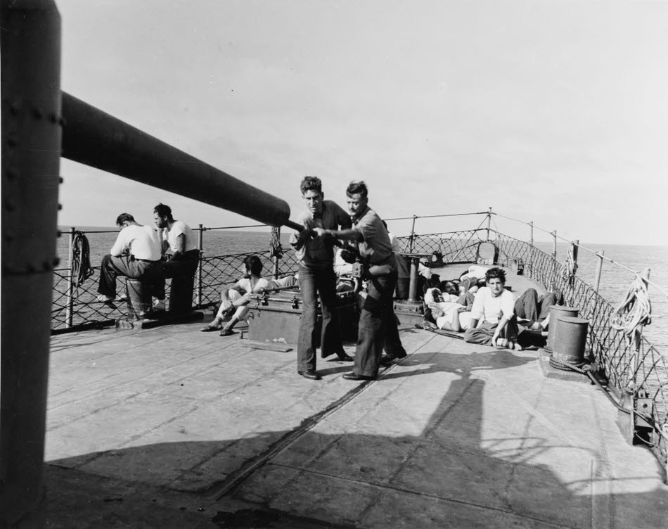 Cleaning 5in gun on USS Buck (DD-420) 