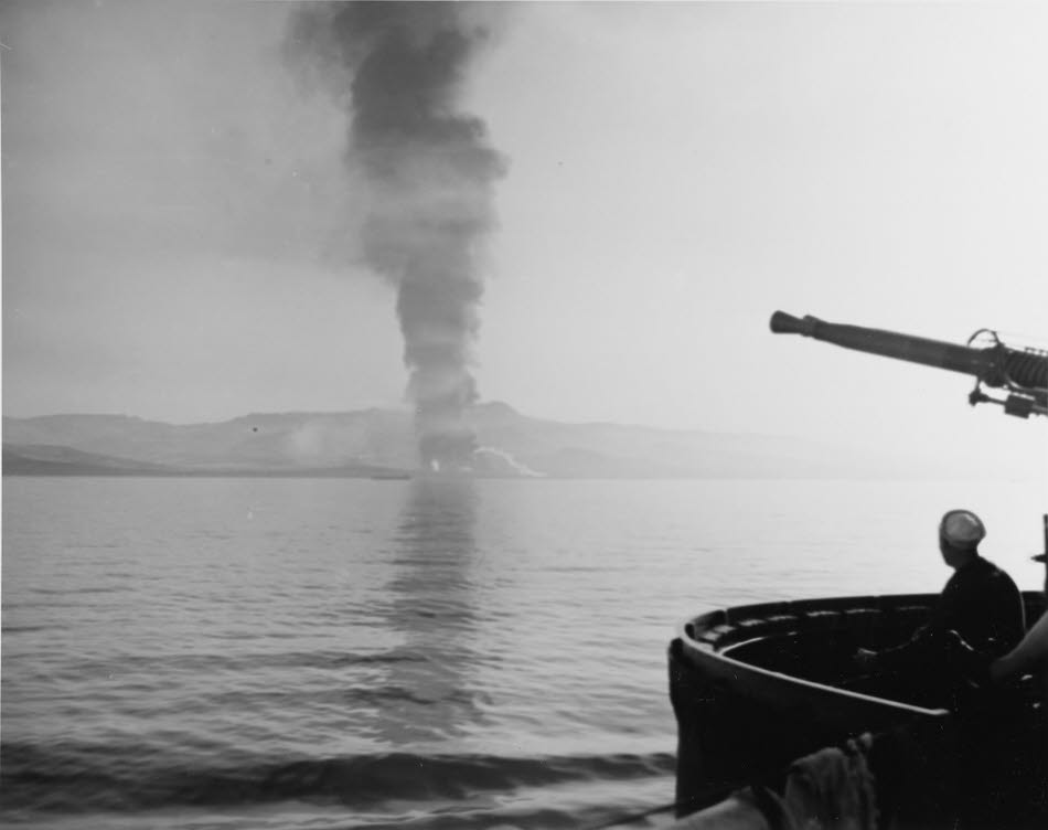 Fire at Licata seen from USS Buck (DD-420)