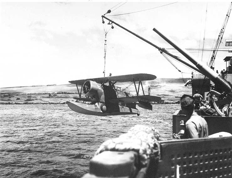 Grumman J2F being lowered from USS Concord (CL10)