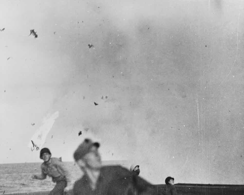 Crew on USS Marcus Island (CVE-77) ducking 