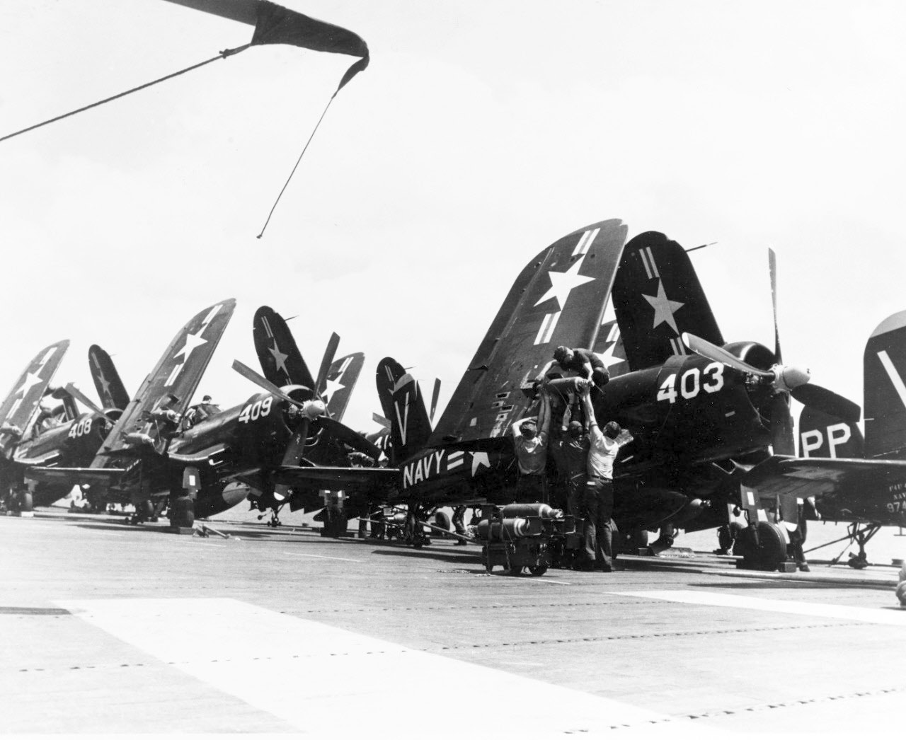 Loading bombs onto F4U, USS Philippine Sea (CV-47) 