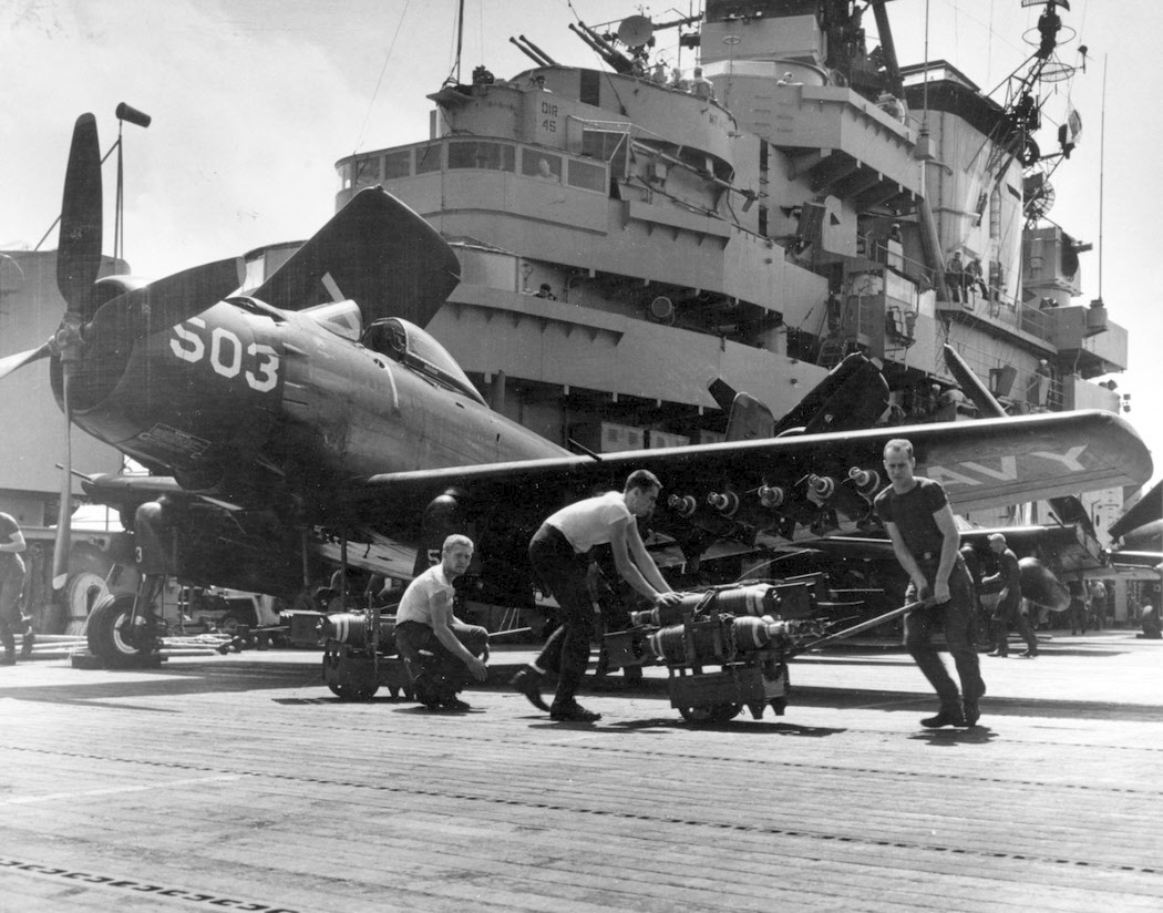 Moving bombs across deck of USS Philippine Sea (CV-47) 
