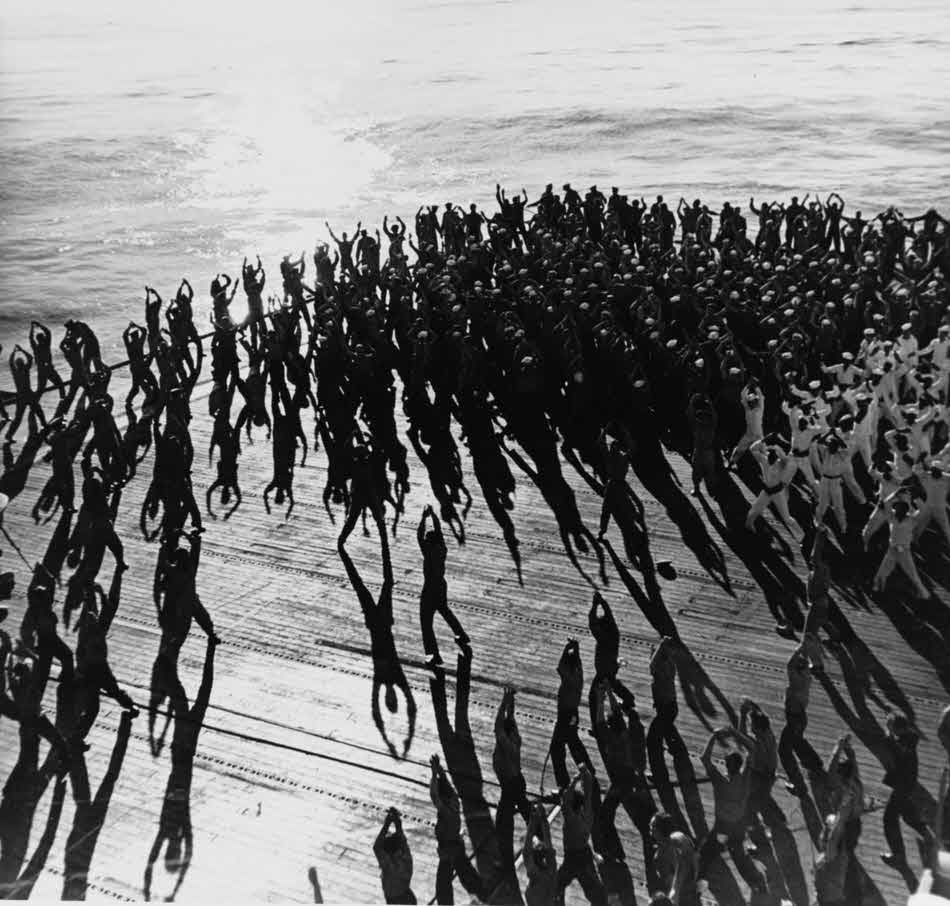 Crew of USS Santee (CVE-28) exercising on deck 