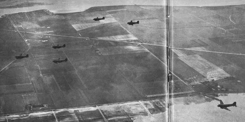 Formation of Douglas C-47s in flight 