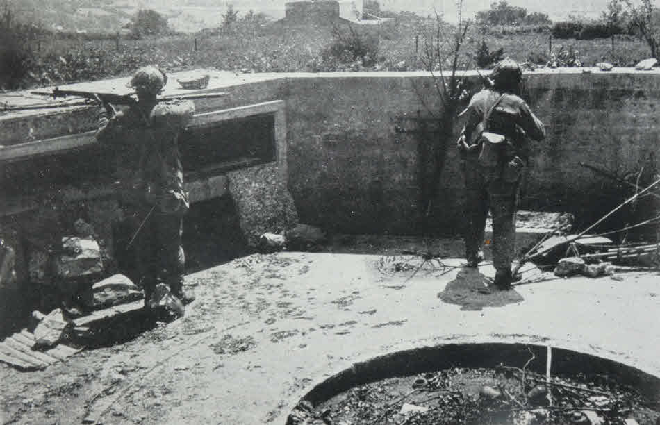 US Troops in German defensive position near Cherbourg 