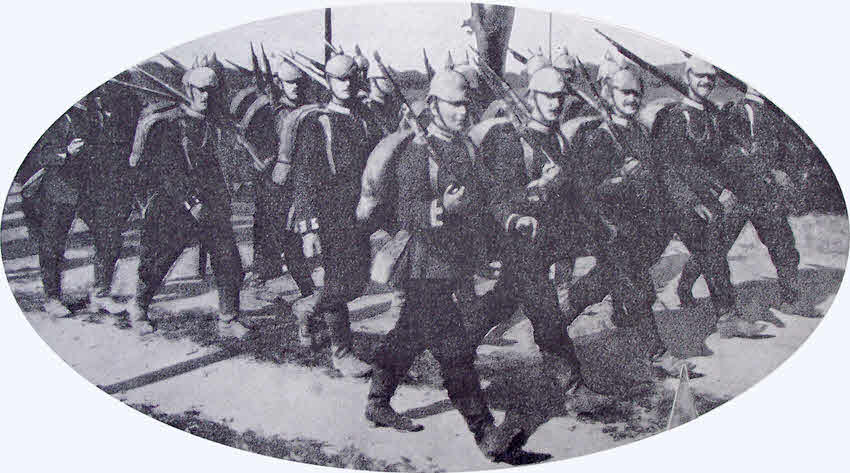 German Troops marching with covered Helmets 