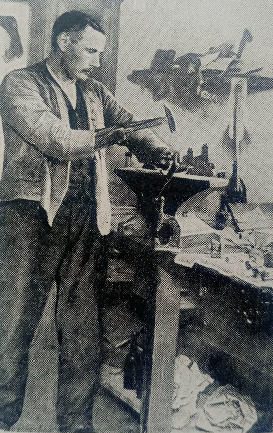 Handless German working with hammer 