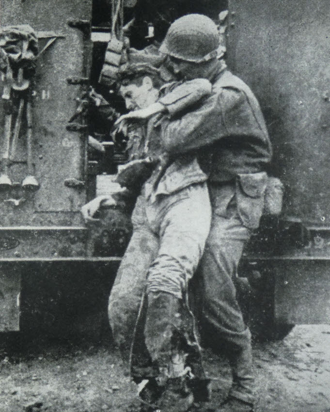 US Soldier helping wounded German 