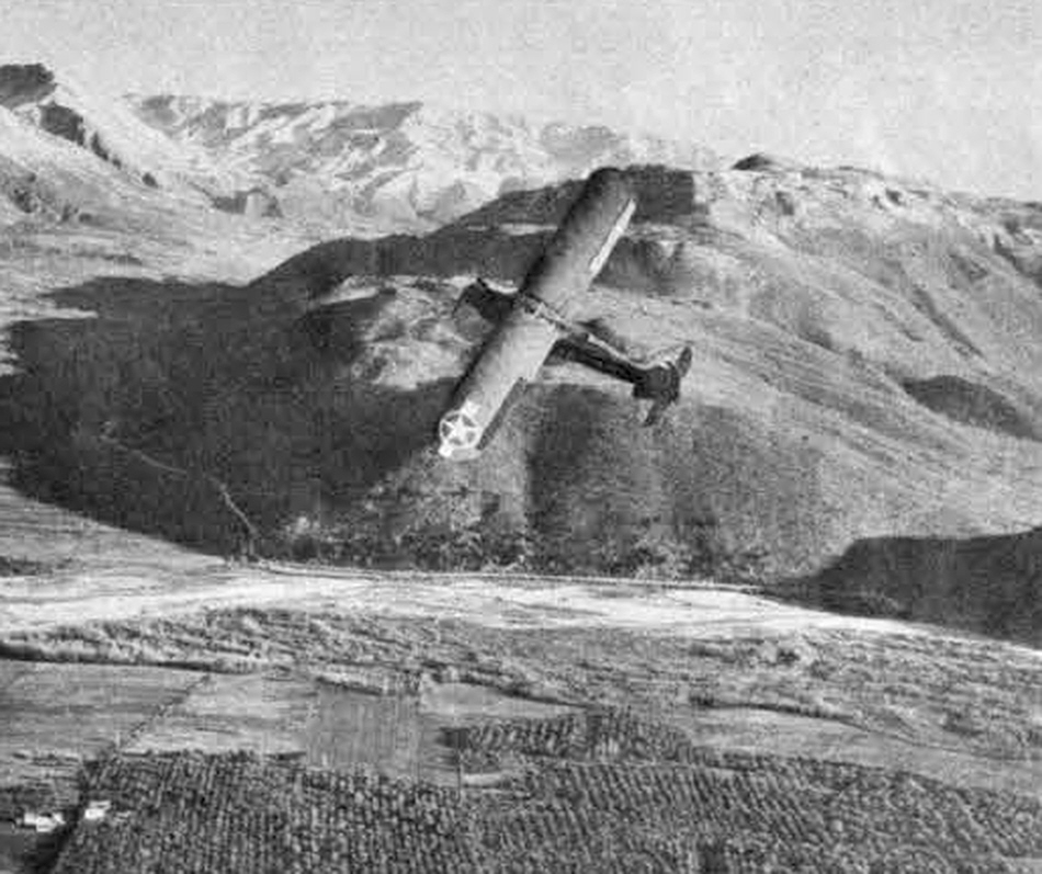 Piper L-4 Grasshopper over the mountains 